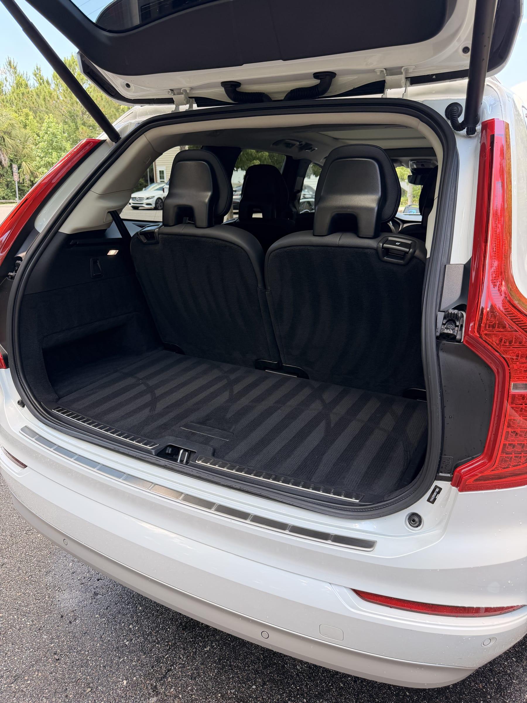 Clean cargo area and rear seats of a white Volvo XC90 after an interior detail